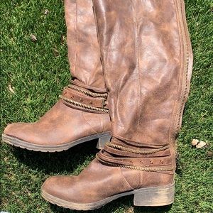 Super cute brown boots with gold accents!